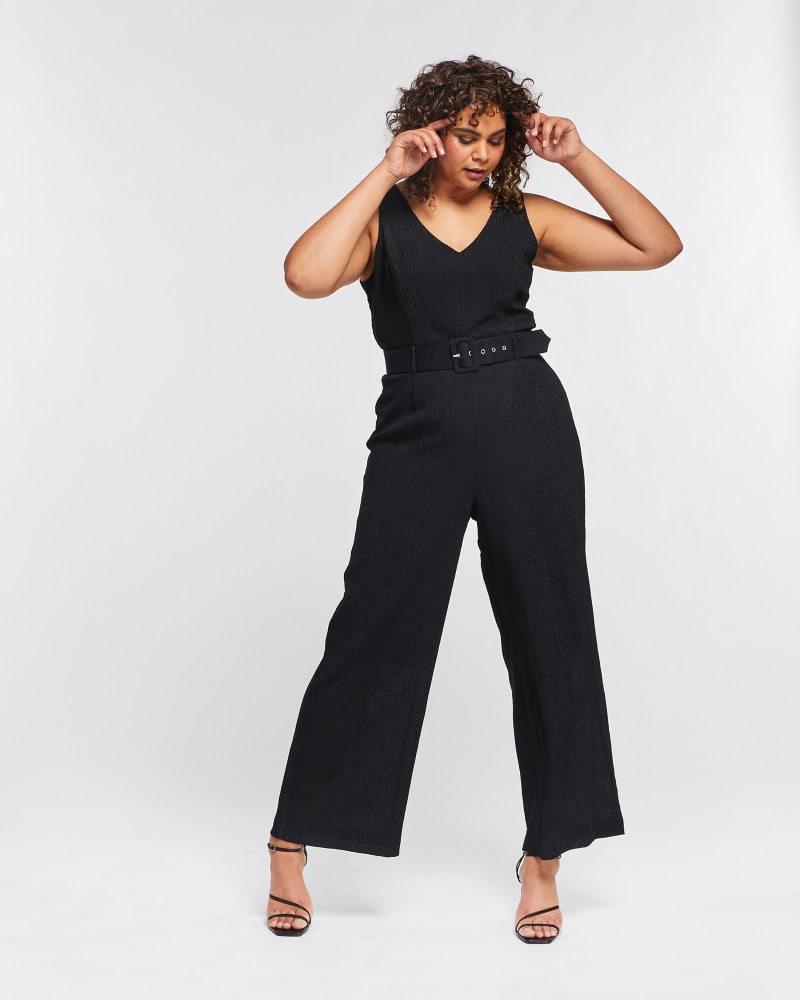 Front of a model wearing a size 4X Malo Crinkled Jumpsuit in Black by Estelle. | dia_product_style_image_id:264719